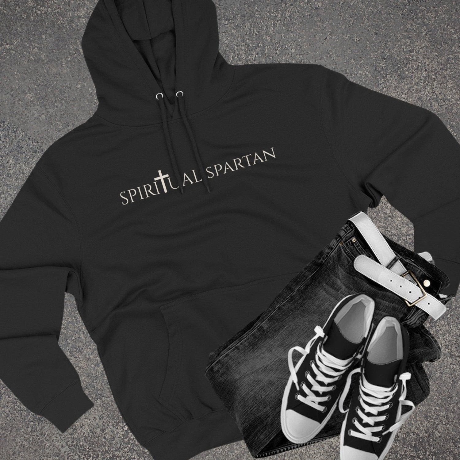 Men’s apparel folded on a shelf in a clean, minimal environment.