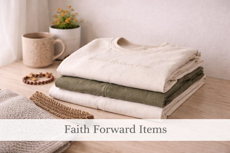 Neutral folded apparel representing faith-forward clothing collections.